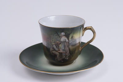Green cup & saucer painted with country scenes