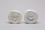 Two family crest moulds.