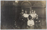 Postcard printed with photograph of family group (possibly Collier)